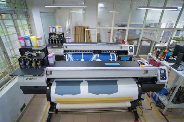 Ba Ria VIETNAM OCT 20 2022 Interior factory Large printing machine for paper business in printing room Sublimation concept