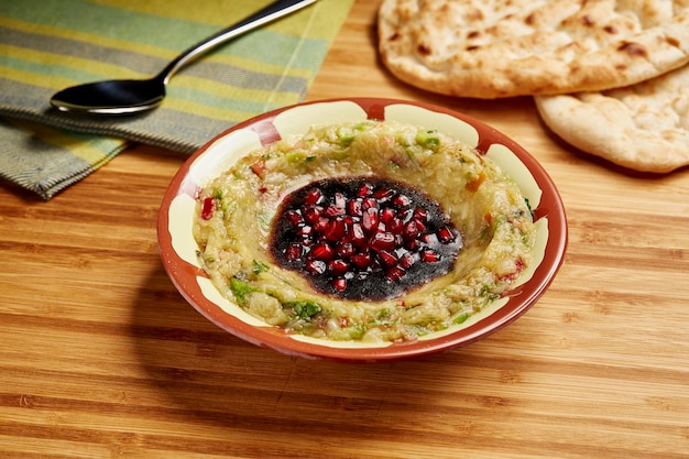 Baba Ghannoug with Bread served in dish isolated on table side view of middle east food