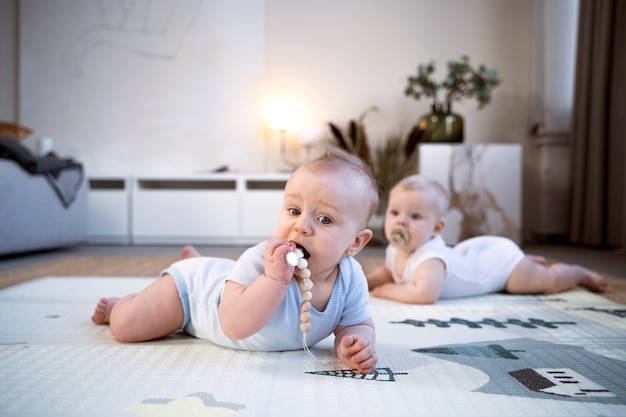 Babies crawling and learning to walk together