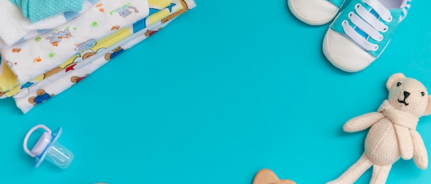 Baby accessories for newborns on a colored surface