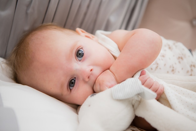 baby in a baby bed 