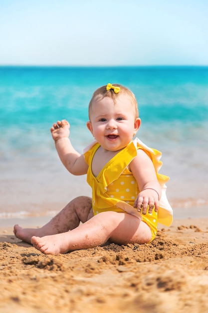 Baby on the beach near the sea