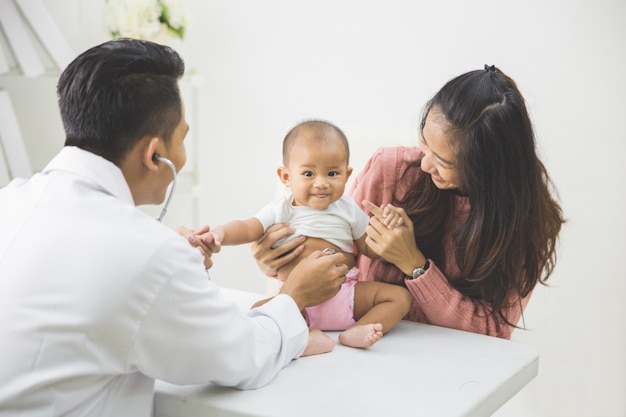 Baby being checked by a doctor