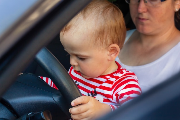 Baby boy driver travel with kids concept