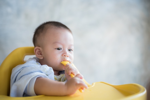 baby boy eating food