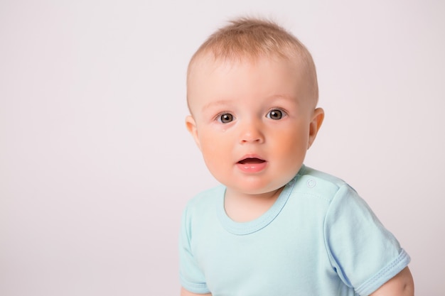 baby boy smiling on white