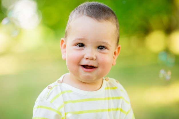 Baby boy on a walk in the park