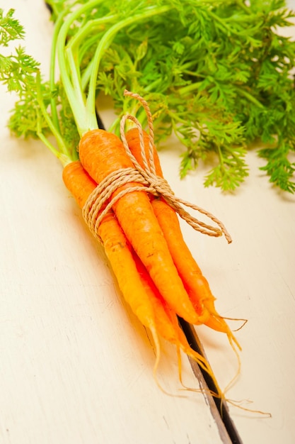 Baby carrots bunch tied with rope