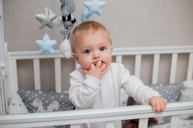 baby in a child's bed