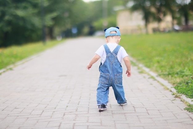 baby child on a summer walk in the park