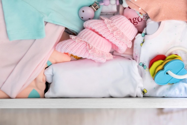 baby clothes arranged in a drawer Close up