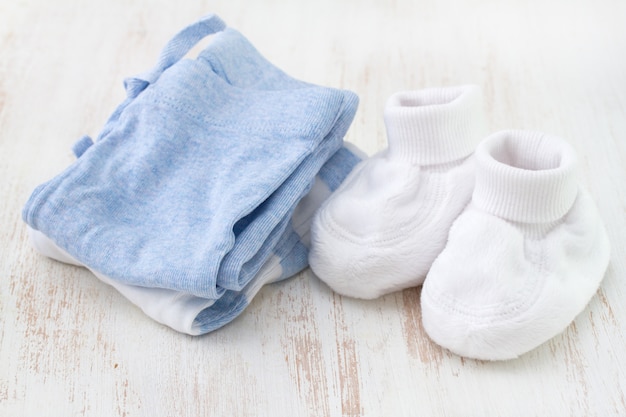 Baby clothes on white surface