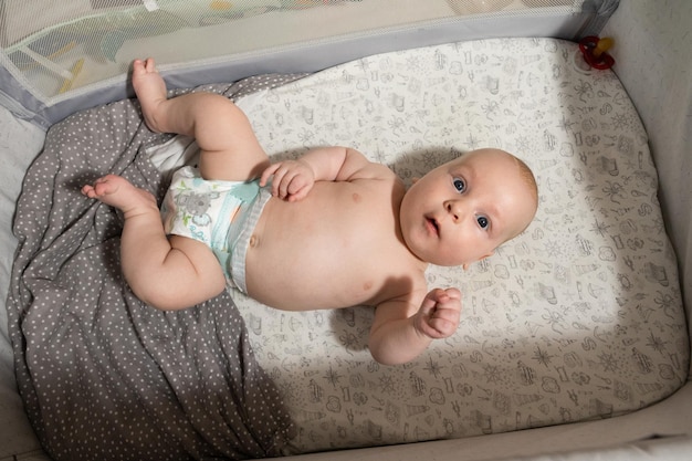 baby in crib, top view