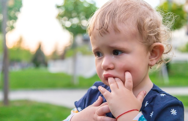 Baby crying in the park Selective focus