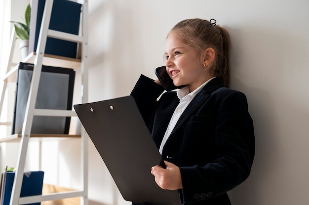 Baby dressed up as business person