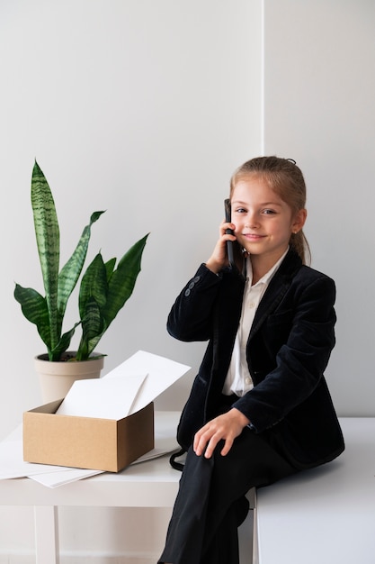 Baby dressed up as business person