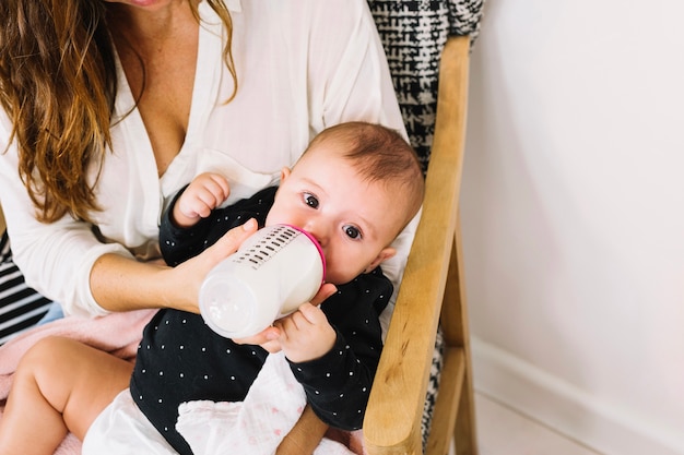 Baby drinking milk from bottle