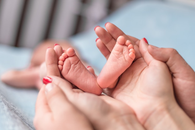 Baby feet in mother hands