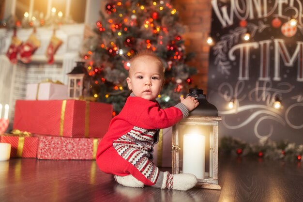 Baby first Christmas Beautiful little baby boy celebrates Christmas New Year