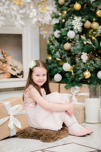 Baby girl in Christmas interior