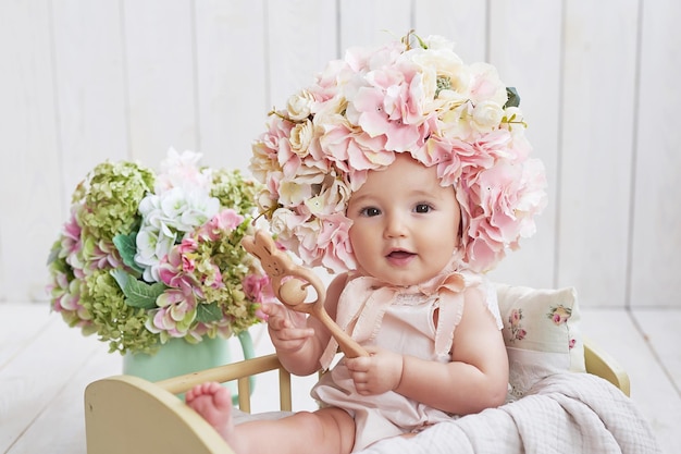 Baby girl in flower hat Postcard Mother's Day and Easter Children Protection Day World Happiness Day Smiling child