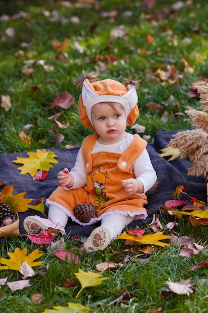 baby girl in a squirrel costume