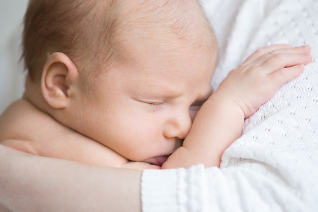 Baby hugging her mother