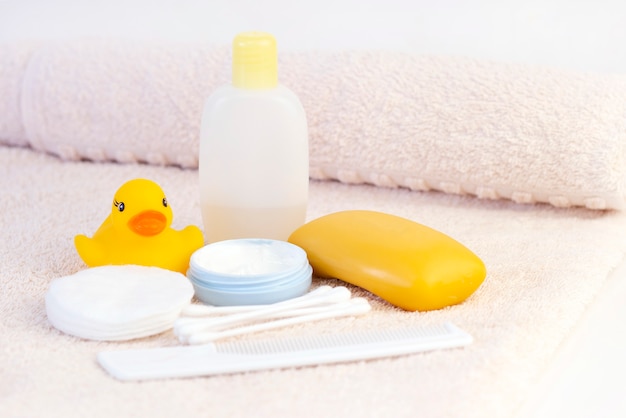 Baby hygiene and bath items on a towel