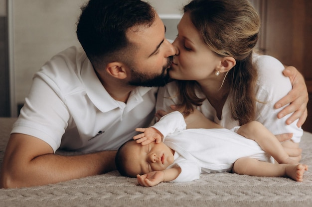 a baby is lying on the floor with the baby in the foreground