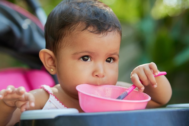 Baby latin girl eating