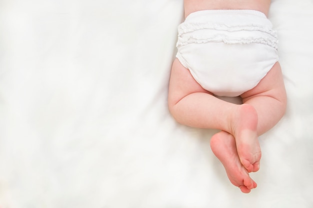 Baby legs isolated on white background