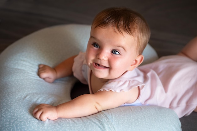 Baby lies on a pillow