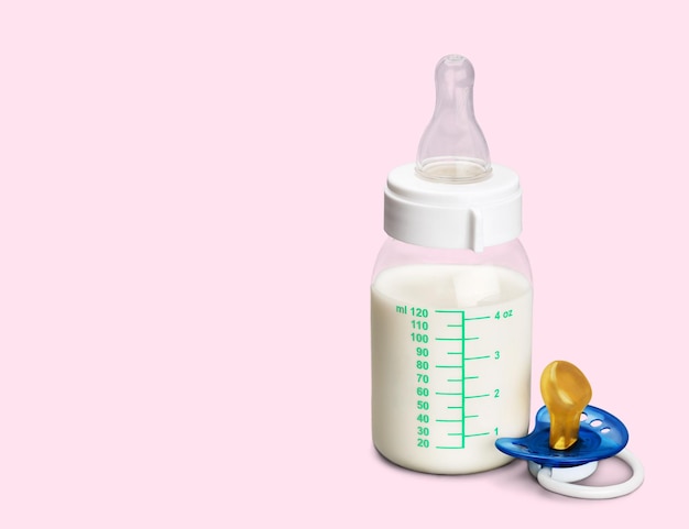 Baby milk bottle on light background