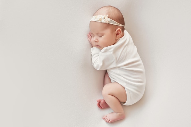 baby newborn girl on a light background