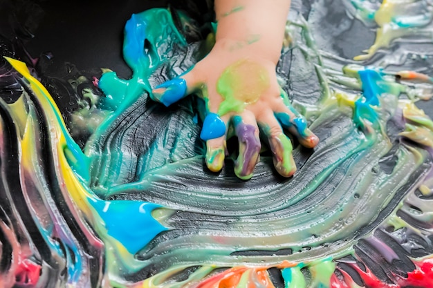 Baby painting with his hands