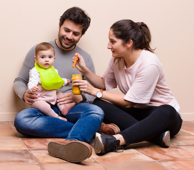 Baby and parents having lunch