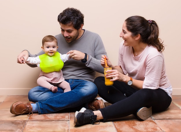 Baby and parents having lunch