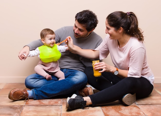 Baby and parents having lunch