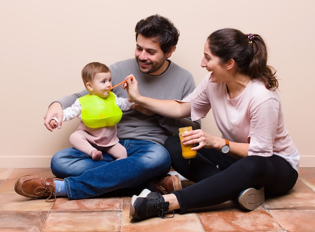 Baby and parents having lunch