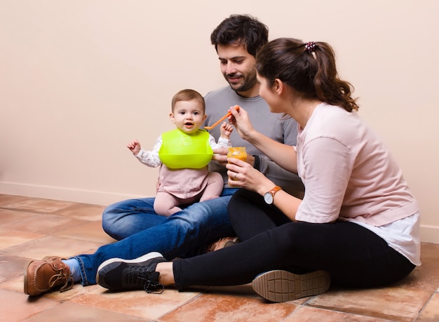 Baby and parents having lunch