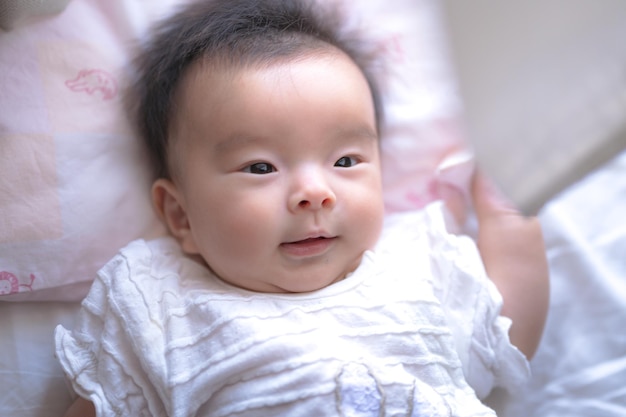 Baby playing with curtains