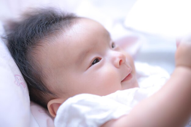 Baby playing with curtains