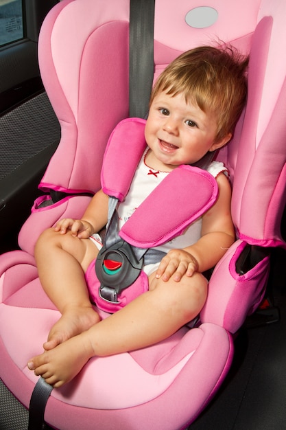 Baby in a safety car seat. Safety and security