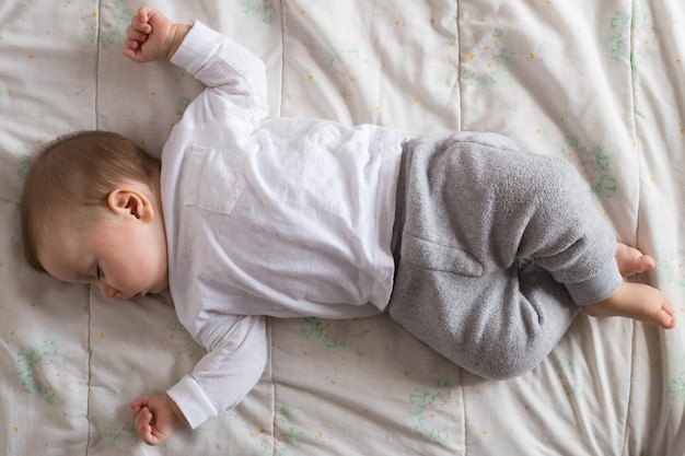 Baby sleeping in bed