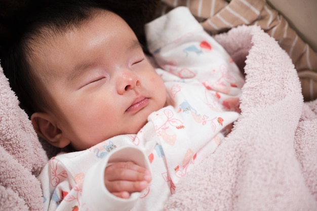 baby sleeping on bouncer