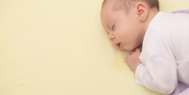 The baby sleeps in the copy space crib Advertising of children's goods Illustrating children's articles A small child A newborn