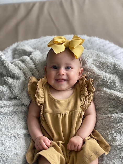 Baby smiling laying on blanket