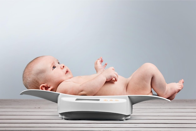 baby on weight scale