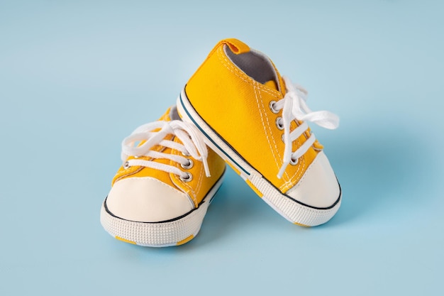 Babys little sneakers on a colorful background The concept of waiting for a baby