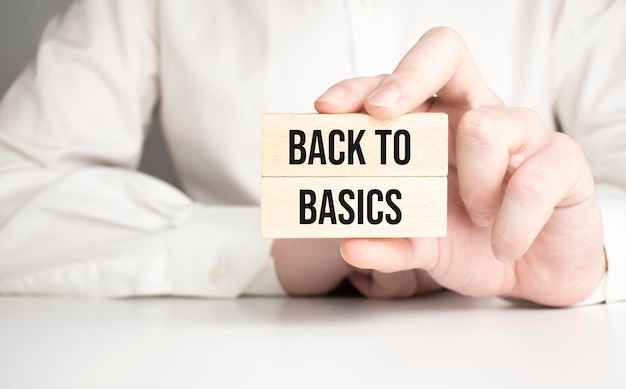 BACK TO BASICS  words from wooden blocks with letters time is now concept